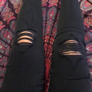 black slightly ripped jeans